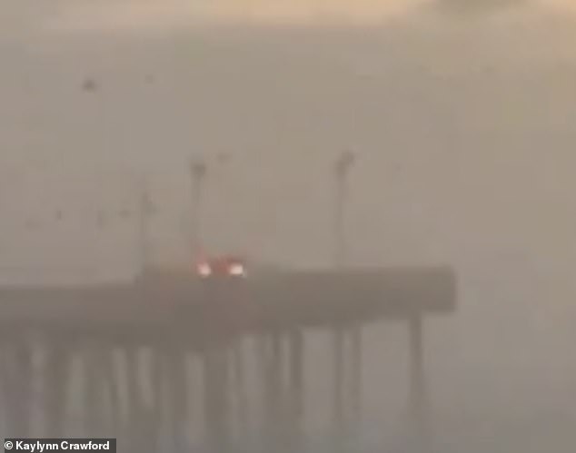 The red Nissan appeared to brake for the end before driving over the edge of the pier