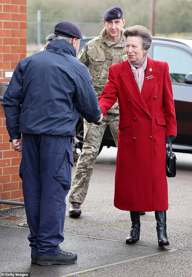 Princess Anne shakes hands with Lieutenant Darren Powell during her visit to the Defense Explosive Ordnance Disposal Training Regiment at St George's Barracks