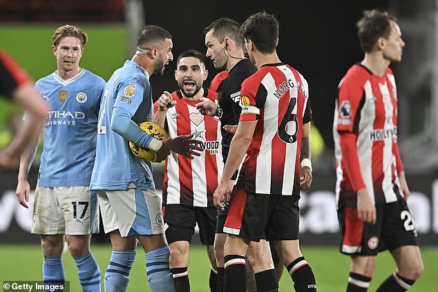 Brentford striker Neal Maupay (centre) was again at the center of controversy after he was seen in a verbal altercation with Man City captain Kyle Walker (second from left) on Monday evening.