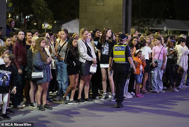 The 34-year-old pop megastar will play four sold-out shows at Accor Stadium this weekend, attracting up to 80,000 people each night.  Pictured Taylor Swift fans at the MCG