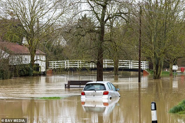 If the AMOC collapses, people in Britain would die from stronger winter storms and floods, and many elderly and young people would be vulnerable to the very cold winter temperatures.  Pictured: A flooded street in Alconbury Weston, Cambridgeshire this month