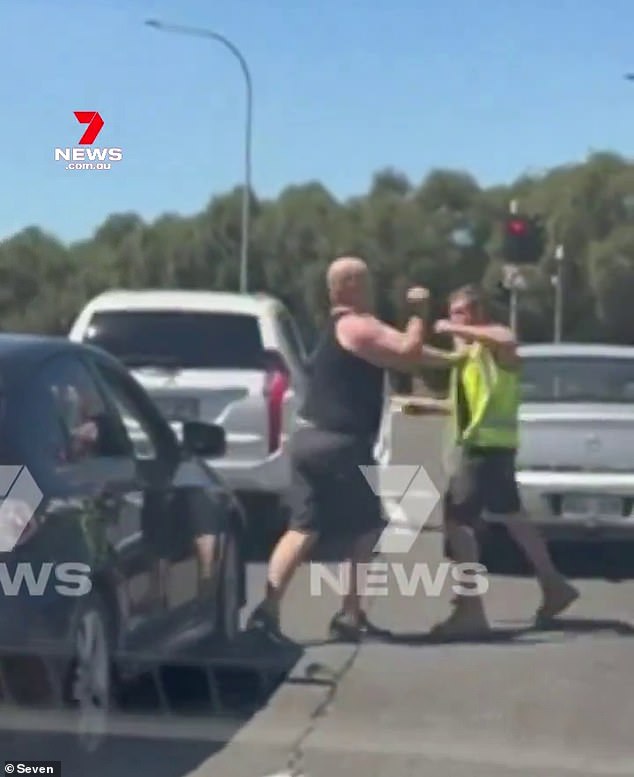 Two men got into a fight while waiting at an intersection in Adelaide on Friday