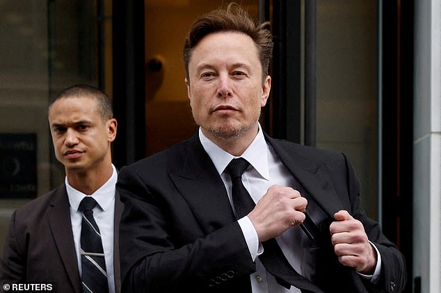 Elon Musk and his security staff leave Tesla's local office in Washington, January 27, 2023