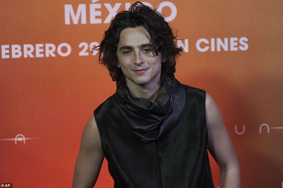 Not one to be left behind, Timothée showed up in his own fashionable look.  The Call Me By Your Name star wore a shiny black sleeveless button-up shirt and more reserved black trousers