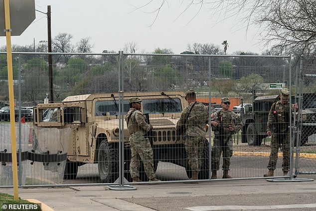 Members of the U.S. National Guard stand guard in Eagle Pass, Texas, where former U.S. President Donald Trump will make a border visit, February 28, 2024