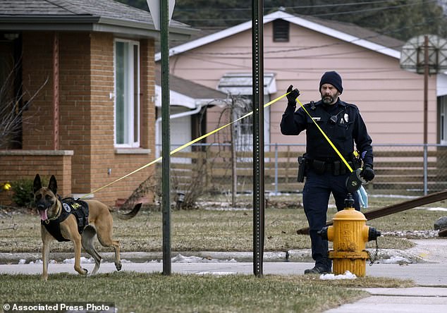 Manitowoc Police Officer Nick Place and a K-9 dog search for missing 3-year-old in Two Rivers, Wisconsin