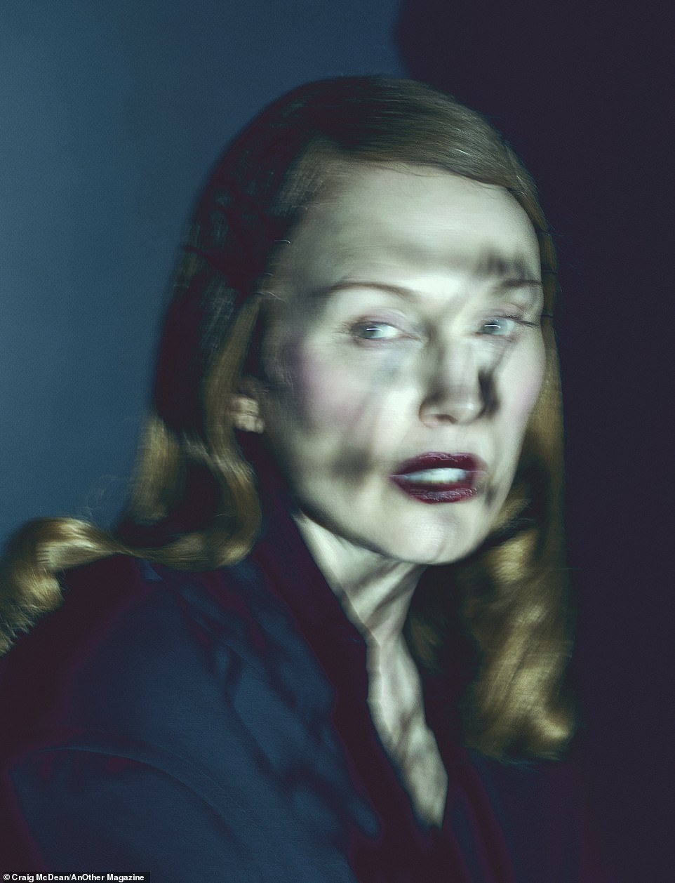 And finally, one photo is almost a profile of the beauty with shadows falling across her face.  Her hair is done in a Veronica Lake style and as she looks over her shoulder it is not clear if she was the hunted or the hunter