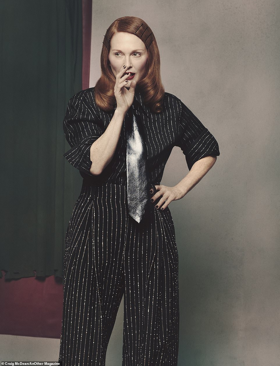 Julianne looks like she's up to something in a Bottega Veneta top and pants