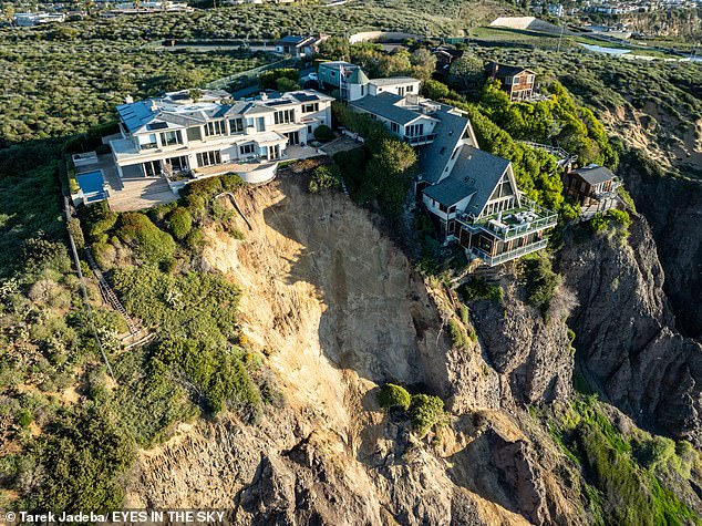 The collapse occurred on Scenic Drive in Dana Point, with mud and debris sliding hundreds of feet down the cliff