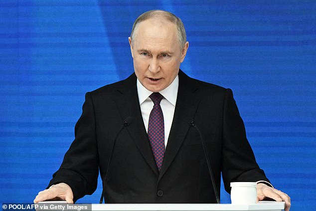 Vladimir Putin has been accused of fueling the migrant crisis to influence politics in Europe.  Pictured: Putin delivers his annual State of the Nation address in Moscow on Thursday