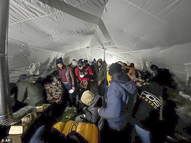 Migrants gathered in a tent to get hot drinks near the border with Finland at the Salla checkpoint in November last year