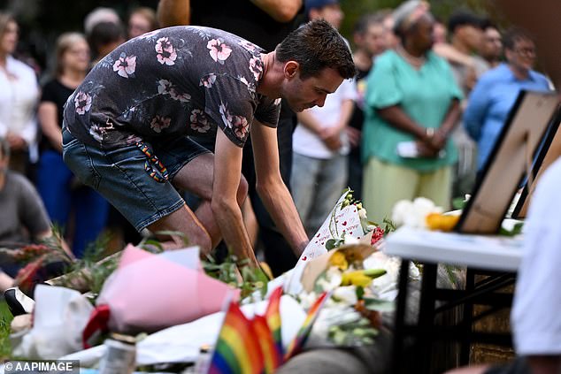 People laid bouquets of flowers at the site of the wake