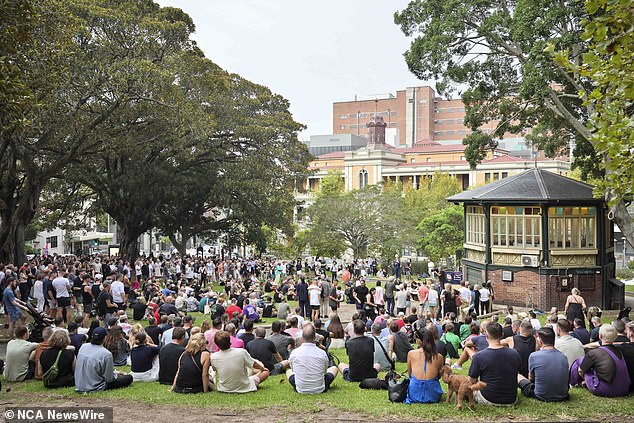 More tributes are planned for Mr Baird and Mr Davies during the Mardi Gras parade on Saturday (attendees pictured gathered at the vigil)