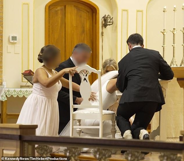 After Catherine collapsed, she was helped into a chair by her husband and other wedding guests, including a bridesmaid