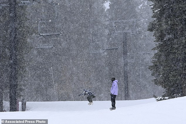 Skiers enjoy a day of skiing and snowfall at the North Star California Resort in Truckee, California, on Thursday
