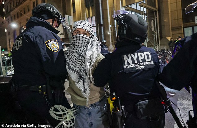 Amid the chaos, protesters witnessed brutal challenges to police officers, with a woman in a hijab repeatedly urging the police officers to 