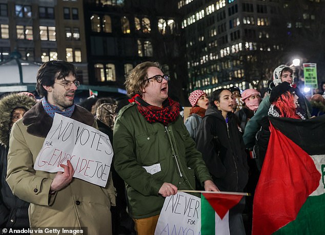 1709306136 35 Pro Palestine protesters mount Wall Streets famous Charging Bull and challenge