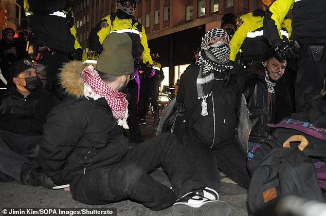 Members of the New York Police Department arrest pro-Palestinian protesters during a march near City Hall