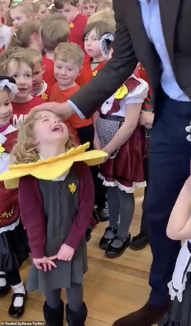 After a brief interaction with the student, the prince patted her on the head before addressing the rest of the class