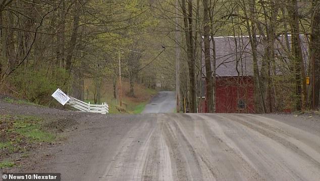 According to Zillow, Kevin Monahan's house was built in 2004 and is estimated to cost $310,000.  It is only accessible via a dirt road.