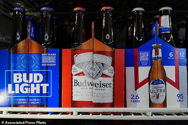 Six-packs of Bud Light, Budweiser and Michelob Ultra are on display at a liquor store in Fairfield, California on February 28, 2024