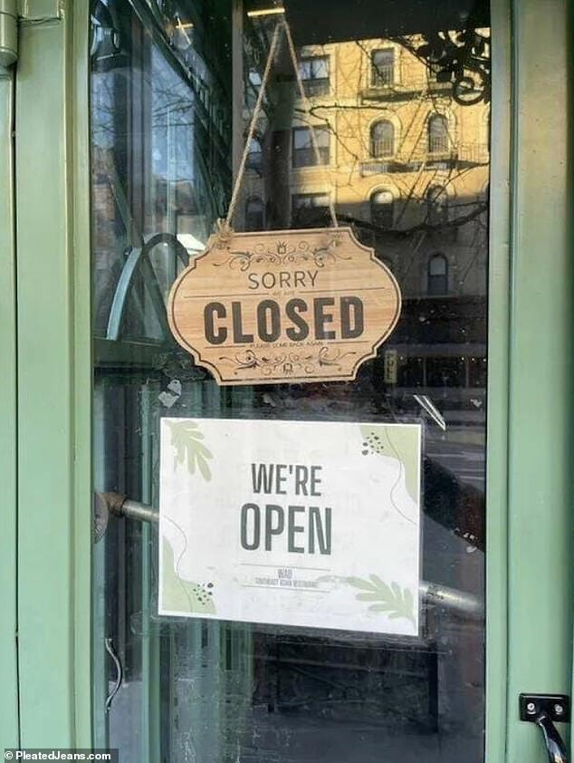 A cafe left customers scratching under a closed sign saying they are open