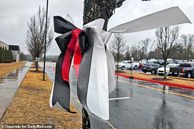 Before the service, memorial arches in red, black and white were placed in front of the church