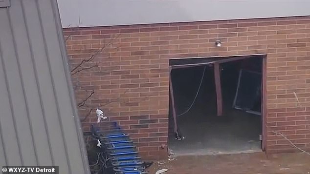 Exterior footage shows the Walmart store's side doors were destroyed, leaving remnants of the metal door frame