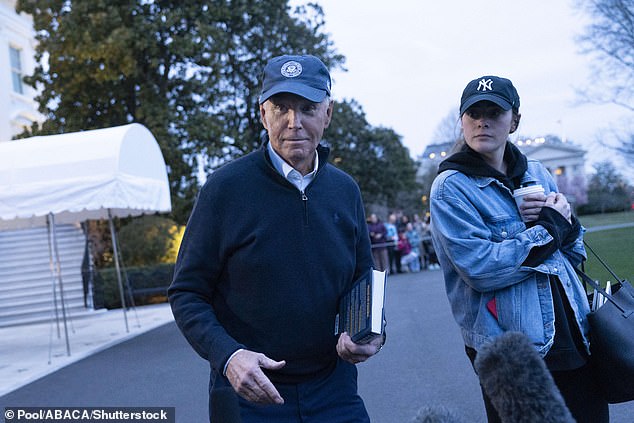 Biden, together with his granddaughter Naomi, addresses reporters ahead of a weekend at Camp David