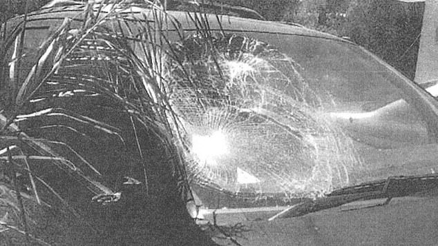 Police photocopied originals show the SUV's windshield shattered by a heavy impact to the driver's side