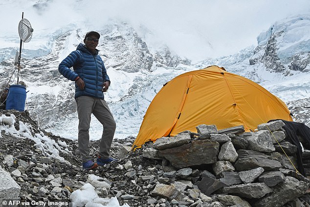 Nepalese mountaineer Kami Rita Sherpa poses for a photo during an interview with AFP at the Everest base camp on Mount Everest in 2021