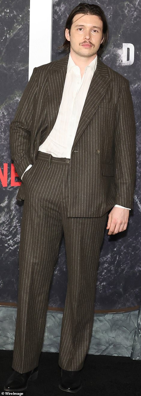 Nick Robinson was a sizzling sensation in an olive green pinstripe suit