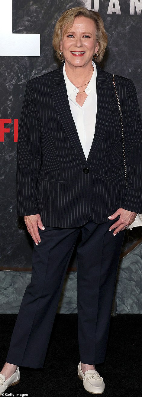 Eve Plumb went for a mismatched look in a black jacket and midnight blue pants