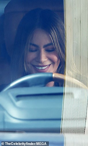 The Colombian-born star flashed her signature smile as she got back into her car