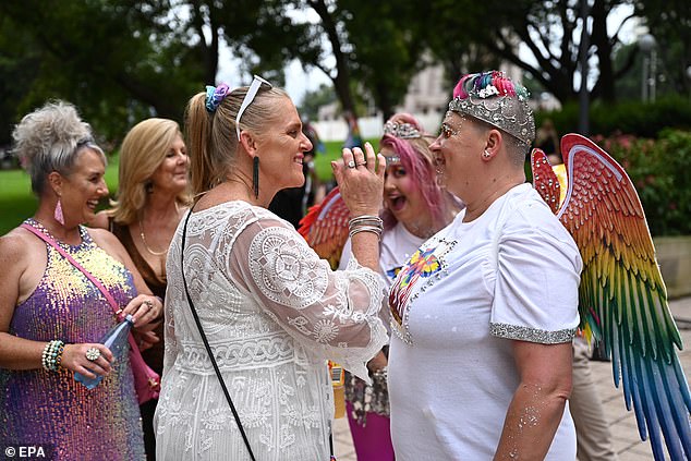 Event attendees (photos) begin marching when the parade begins at 7:30 PM and ends in Moore Park around 11:00 PM.