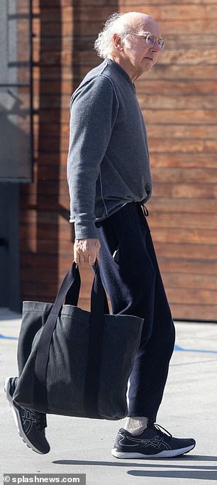 David looked relaxed in black sweatpants, a gray sweatshirt and sneakers