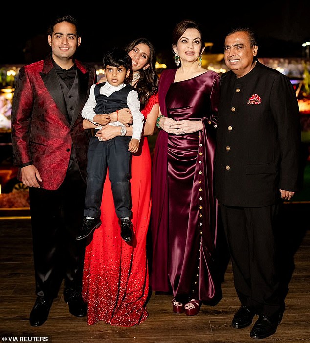 Reliance Industries Chairman Mukesh Ambani, Nita Ambani, Akash Ambani, Shloka Mehta and Prithvi Ambani pose for a photo during the pre-wedding celebrations of Ambani's son Anant Ambani