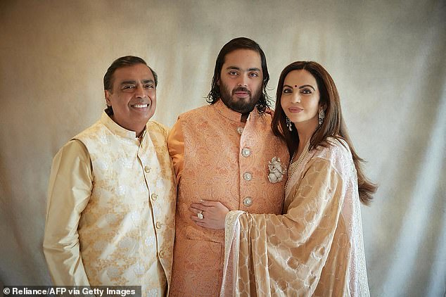 Billionaire tycoon Mukesh Ambani (left) and his wife Nita Ambani, chairman and founder of the Reliance Foundation, with their son Anant Ambani