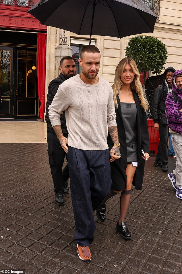 Liam cut a casual figure for the outing in a white jumper which he wore with navy blue jeans