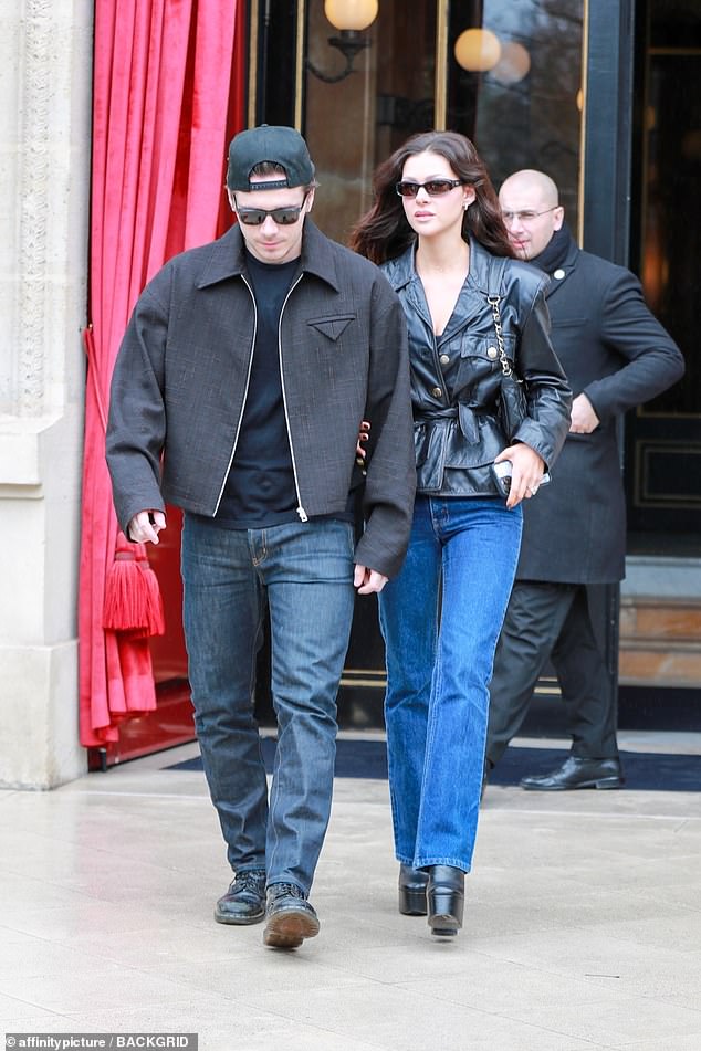 He completed his outfit with a pair of Dr.  Martens, added an upside-down baseball cap and protected his eyes with sunglasses.