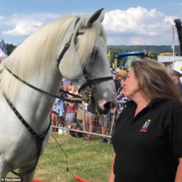 Prosecutor Sean Brunton KC told the jury that Mrs Rawle (pictured with a horse) had picked up the knife to cut a cord to tie down the gates as her husband had requested.