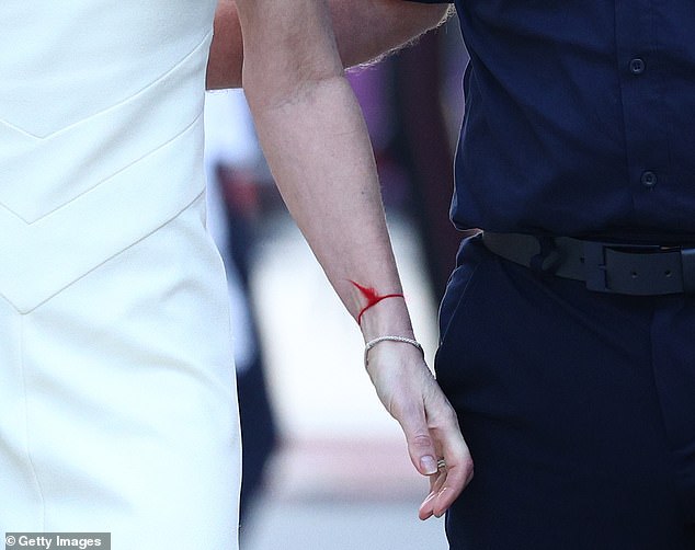 The singer was seen wearing a red string bracelet on her left arm, which is said to 'ward off evil'