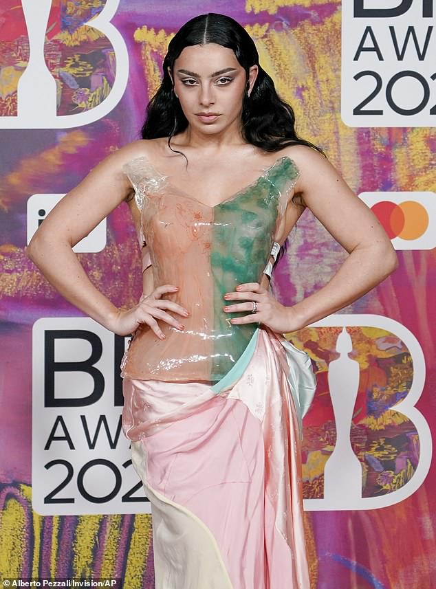 The bodice of the dress had a V-neck and was of glassy quality.  The left half was peach and the right half green