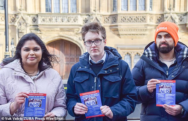 Dr.  Robert Laurenson (center), co-chair of the Junior Doctors Committee, participates in the protest