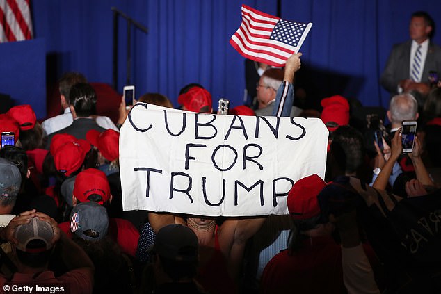 People attend a rally for Vice President Mike Pence as he speaks during the Donald J. Trump for President Latino Coalition Rollout at the DoubleTree by Hilton Hotel Miami Airport & Convention Center