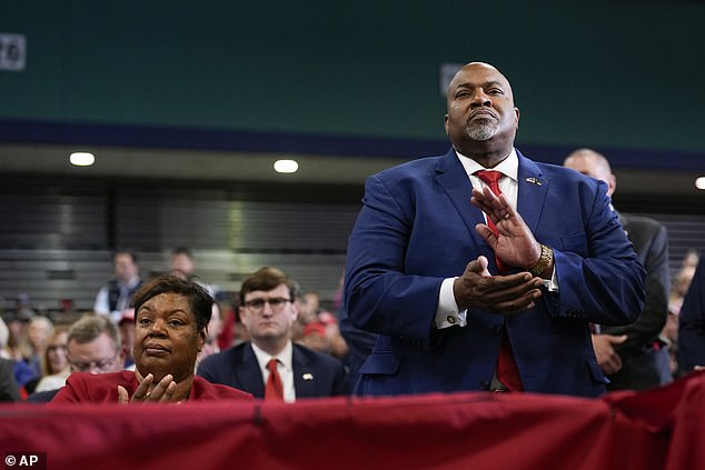 Governor Mark Robinson and his wife Yolanda listen as Republican presidential candidate, former President Donald Trump, speaks at a campaign rally