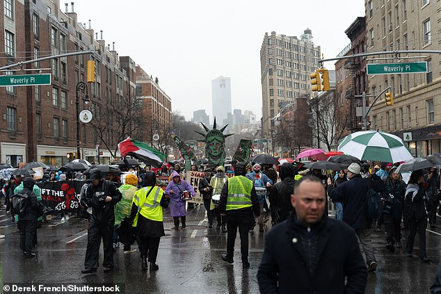 As the demonstrators marched up Sixth Avenue, police followed closely behind them