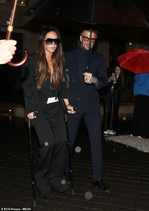 Despite still hobbling on crutches, Victoria cut a chic figure in all black after an ankle injury during a recent gym workout