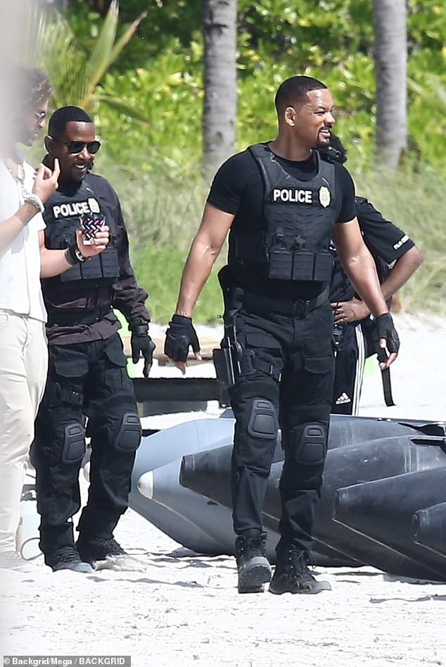 Hollywood good guys Will Smith and Martin Lawrence are busy on the set of Bad Boys 4 as they film on a local beach in Miami.  The production spent $500,000 on police support but was criticized for displacing the homeless