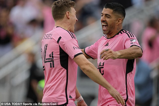 The Uruguayan celebrates one of his goals in the first half with Julian Gressel